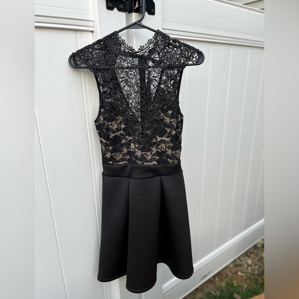 Mini black dress with lace details